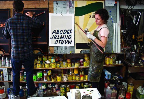 (Ken Davis and Caitlyn Galloway of New Bohemia Signs. Courtesy of Sign Painters and Princeton Architectural Press.)