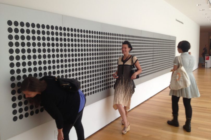 ImageThink team in front of artwork at the MoMa
