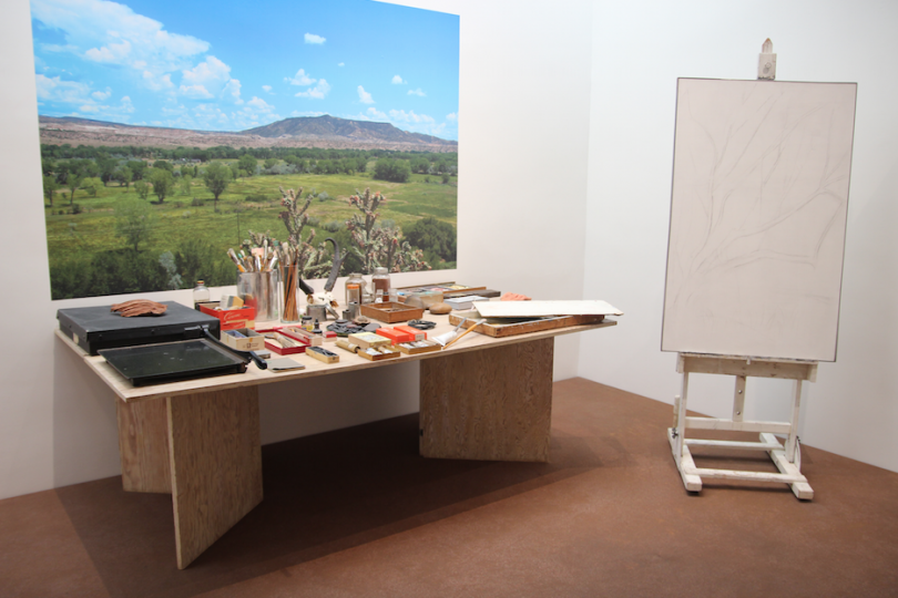 Image of an easel with sketch and art supplies on a table in Santa Fe New Mexico