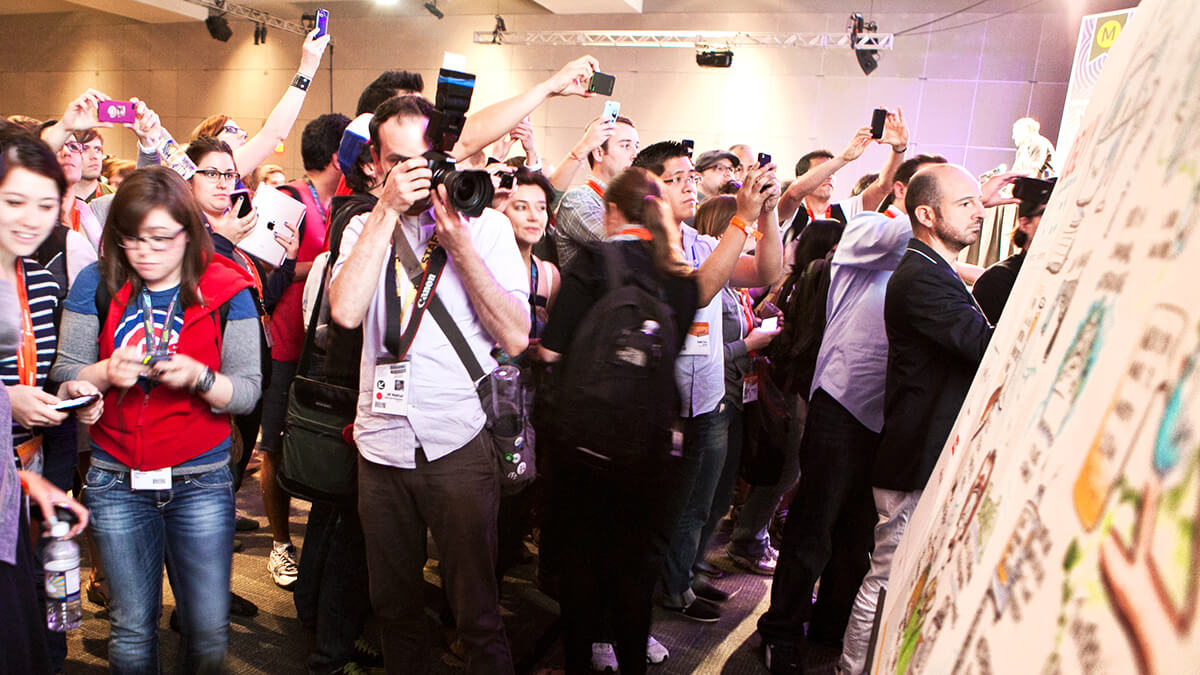 attendees take photos of imagethink's graphic recordings