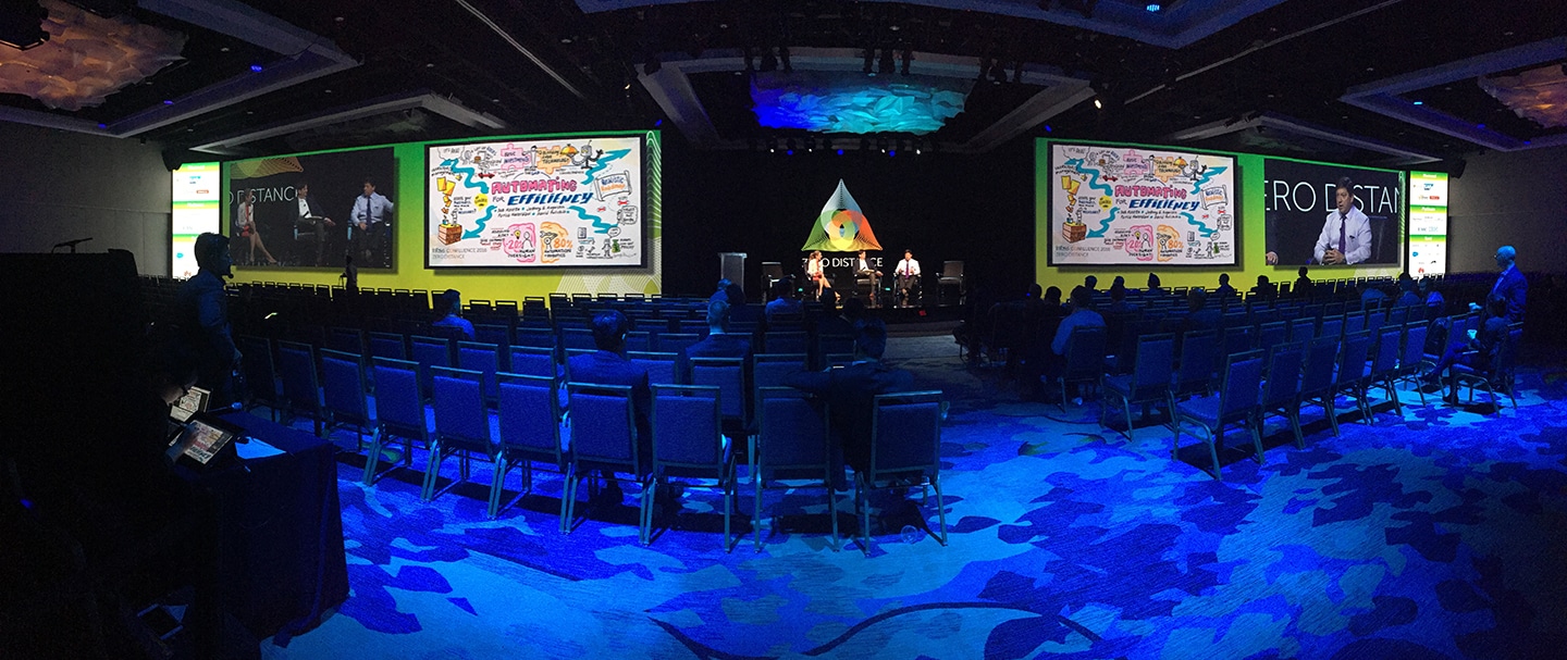 Dual display monitors let attendees at Infosys see the speaker material come to life.