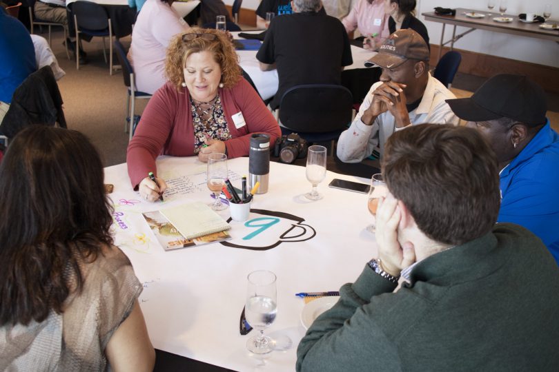 Image of UAH team working visually together.
