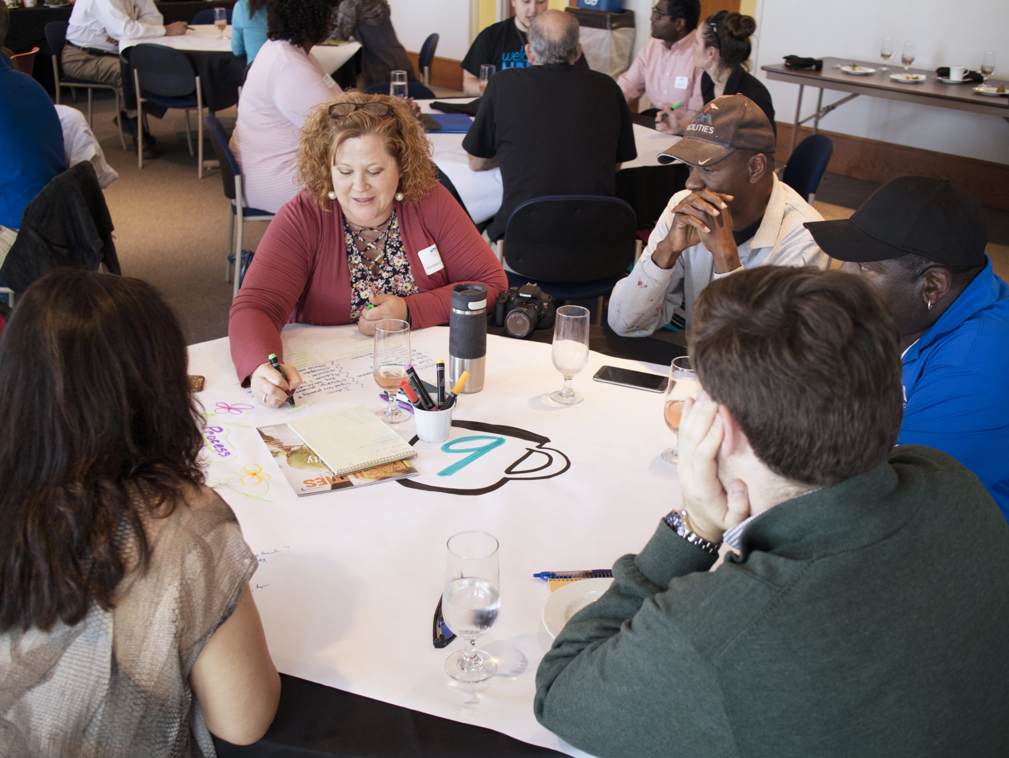 Participants engaging in a visual thinking brainstorming exercise at a workshop