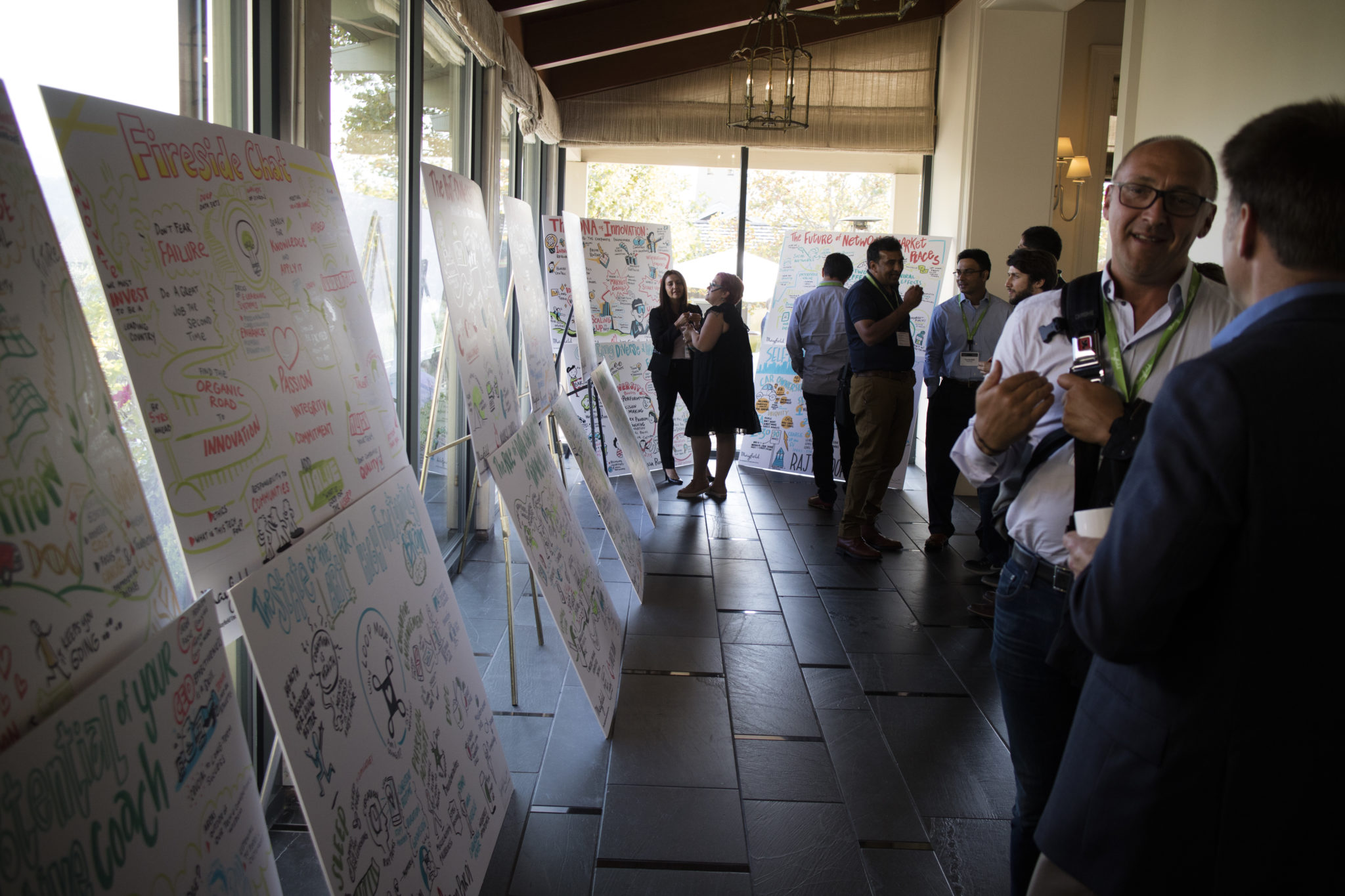 ImageThink's graphic recording fill a hallway at the Mayfield Fund conference in California.