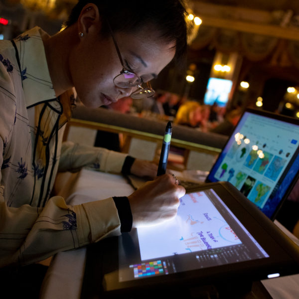 ImageThink graphic recorder scribing digitally on a Wacom Cintiq tablet live at an event.