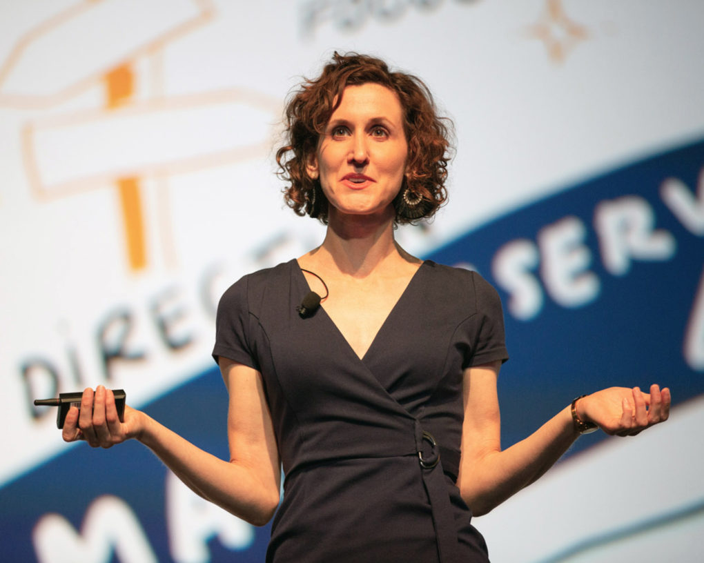 ImageThink Founder and CEO Nora Herting delivering an interactive visual keynote on stage at WBENC.