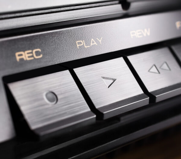 Image of an audio device with symbols of sound design - record, play, rewind, fast forward.