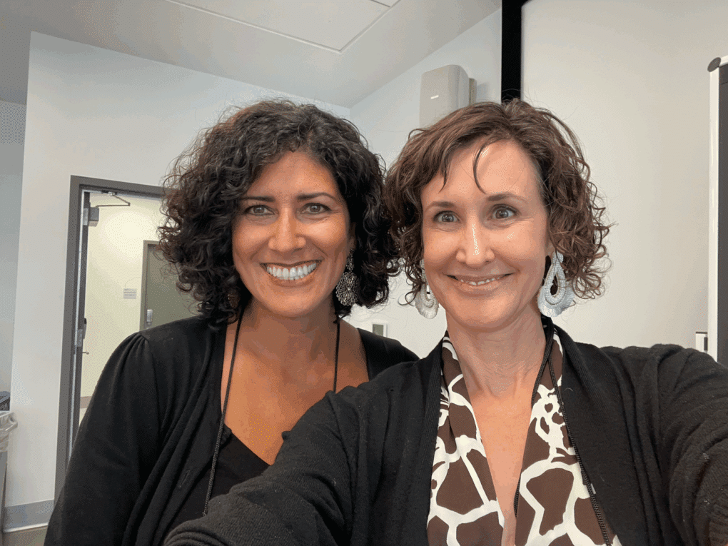 Nora Herting and a former visual strategy workshop student posing for a photo.